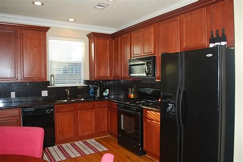 cherry kitchen cabinets with black stainless steel appliances|cherry kitchen cabinet color schemes.